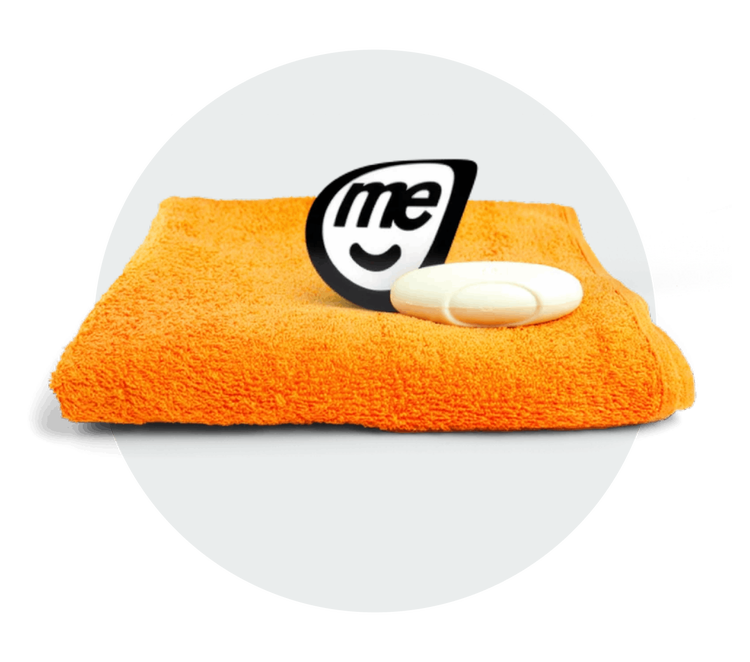Orange towel and white soap bar beside the ME Bank logo