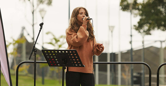 Singer Emily Hatton performing at Mothers Day Classic 