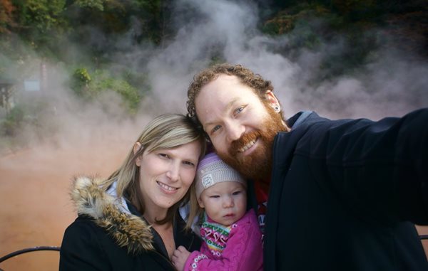 Photo of Adam and Klaire with their child