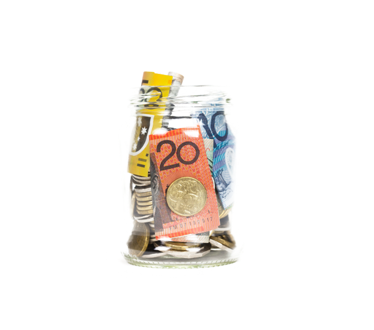 Glass jar filled with Australian banknotes and coins
